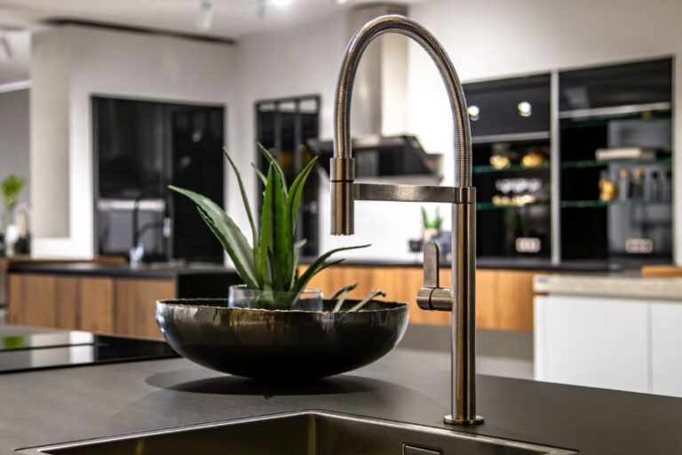 new-modern-steel-faucet-kitchen-room-sink-close-up