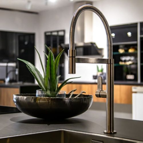 new-modern-steel-faucet-kitchen-room-sink-close-up